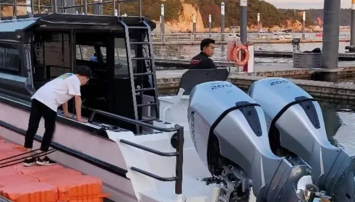 Luxury aluminum fishing boat with sleek design and powerful engines in a marina setting.