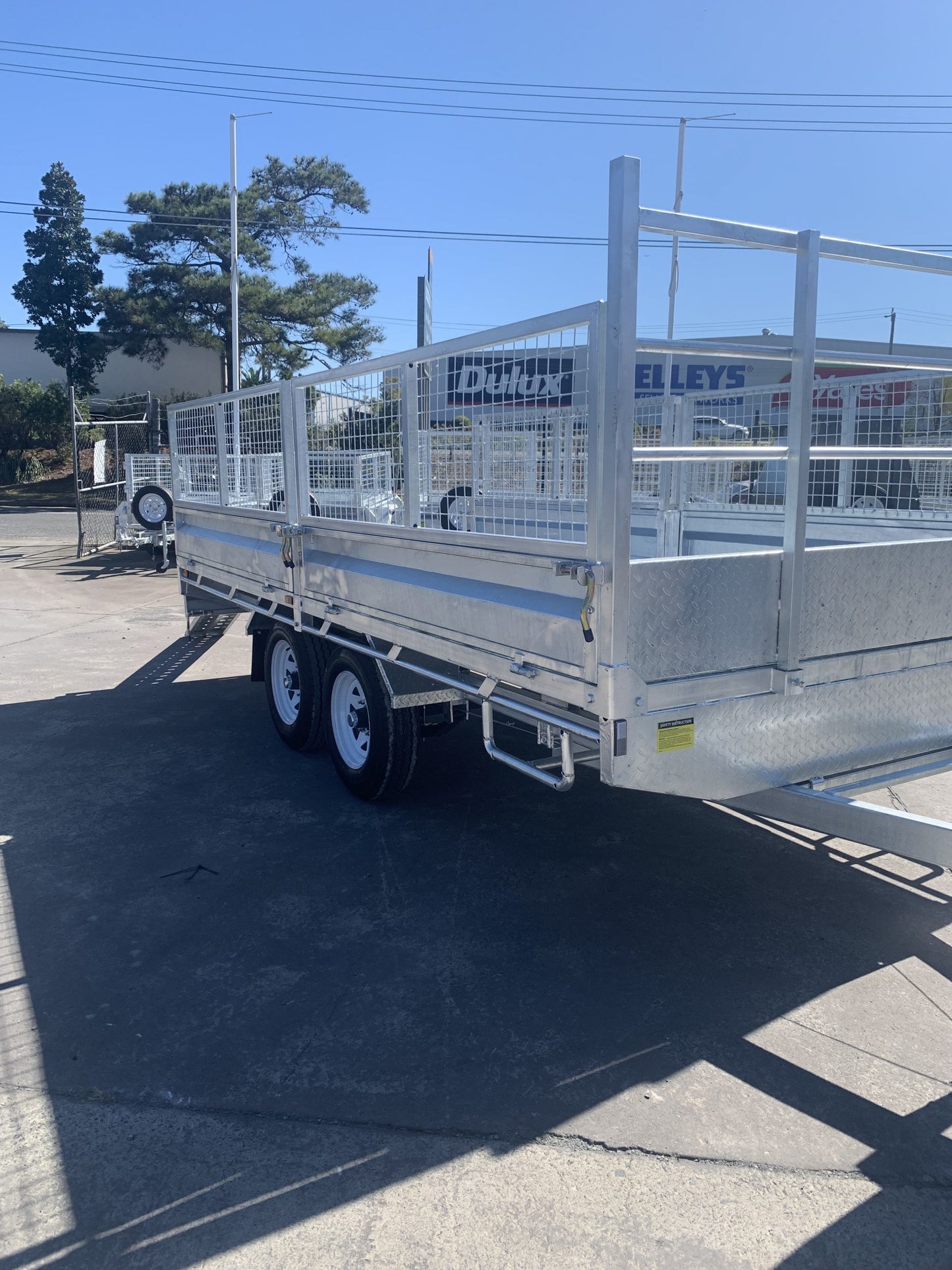 Flat Top Trailers 14 x 7 ft Tandem Flat Deck Trailer with Loading Ramps and cage ATM 3500kg Galvanized QLD