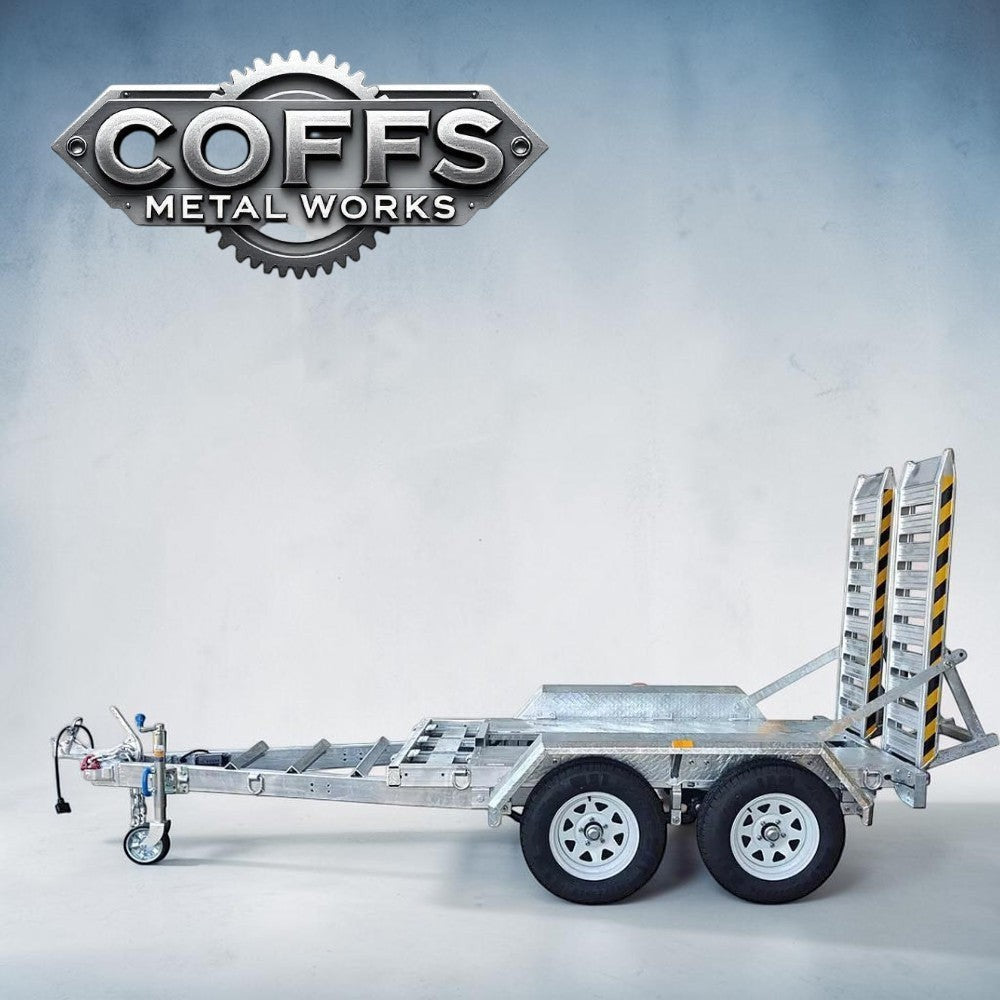 Coffs Metal Works 3000kg plant trailer with dual axles, electric brakes, and aluminium loading ramps. Galvanised chassis.