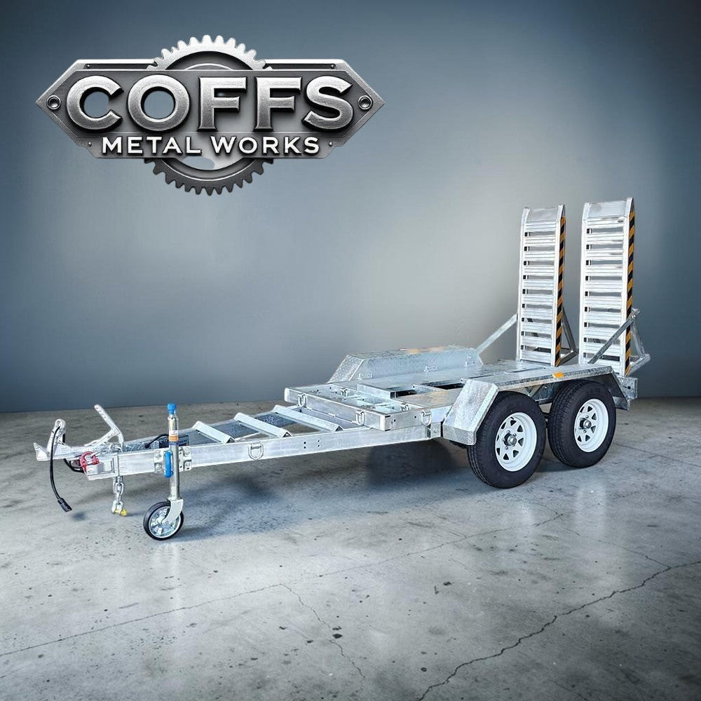Coffs Metal Works 3000kg plant trailer with dual axles, electric brakes, and aluminium loading ramps. Galvanised steel chassis.