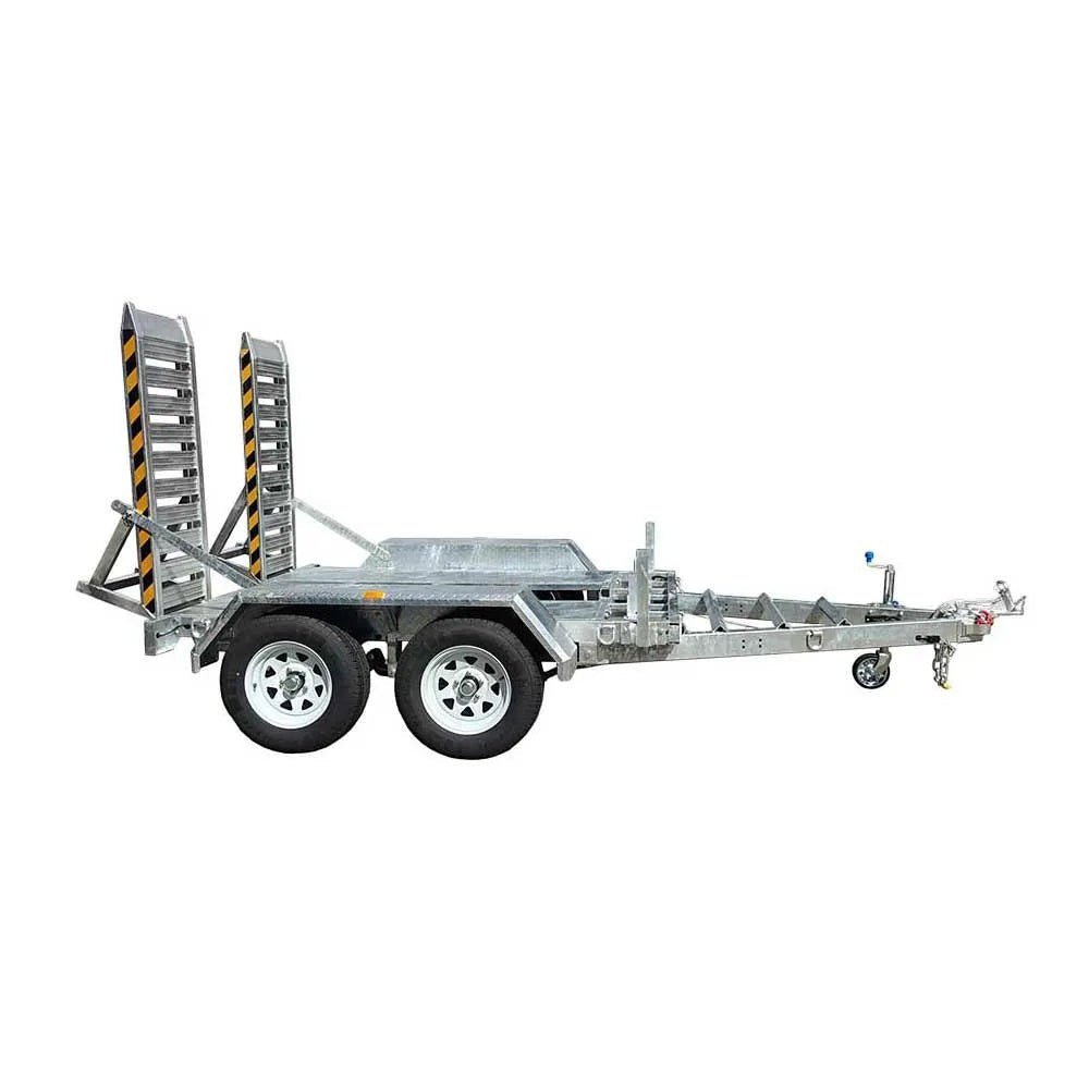 Coffs Metal Works heavy-duty plant trailer with dual axles, aluminium ramps, and galvanised steel construction.
