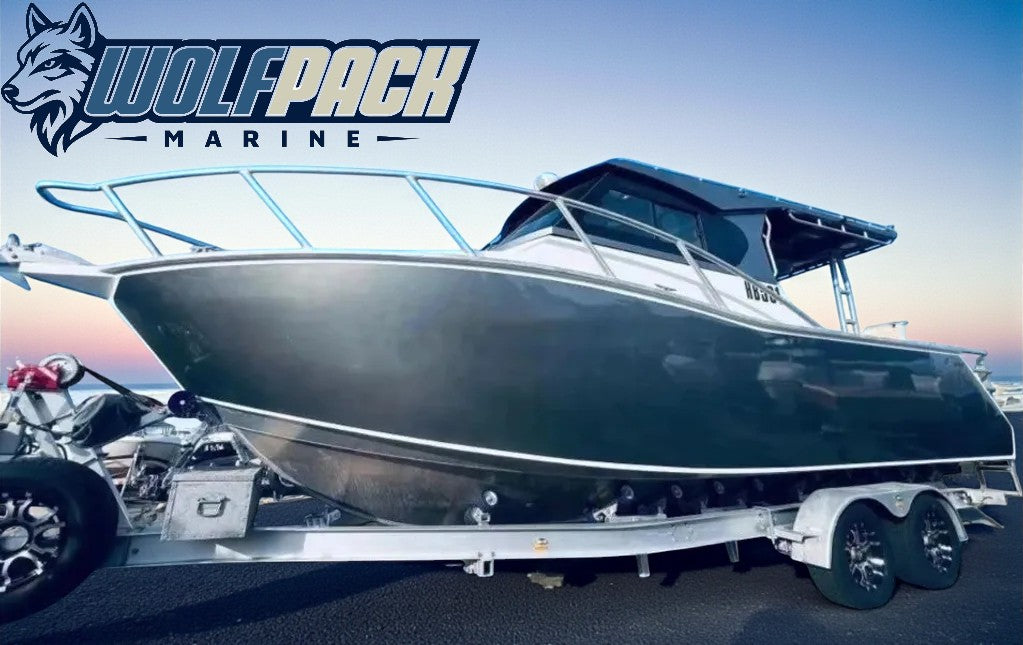 Hunter 685 on a trailer with Wolfpack Marine logo in the background